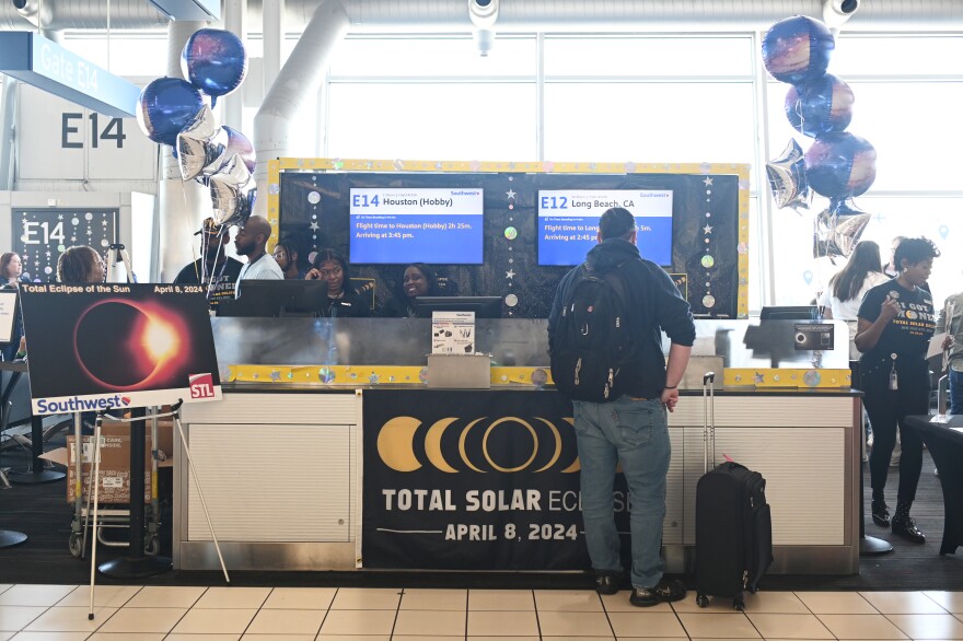 Southwest ticket counter in seen outfitted in eclipse decorations prior Southwest Flight 1910 highlighting the total solar eclipse from St. Louis to Houston, Texas on April 8, 2024, at Lambert International Airport in St. Louis, Missouri.