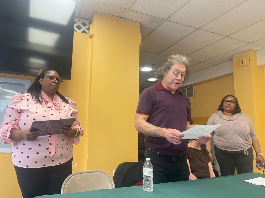 Tyra Wallace (left), Stamford Manor’s property manager, stands with Stamford Manor resident Wayne Esquivel, who has lived there for nearly eight years. Esquivel said his apartment has everything from rusty appliances to wonky floors and is in need of repairs.