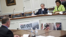 Rep. Walter Jones, R-N.C.; and Rep. Barbara Lee, D-Calif., listen to Army Lt. Col. Danny Davis spoke at a discussion in support of expedited withdrawal of U.S. troops from Afghanistan. (Chris Maddaloni/CQ Roll Call)