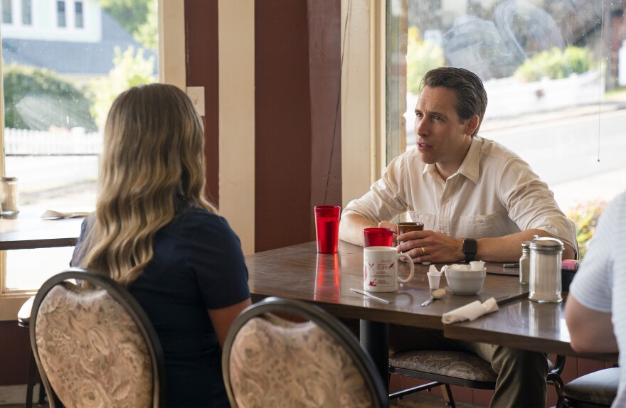 U.S. Sen. Josh Hawley spent last week touring 10 rural Missouri counties. This photo supplied by his staff features the Republican senator talking to a woman in Eminence, Missouri.