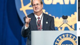 Gary Jones stands at a UAW podium 