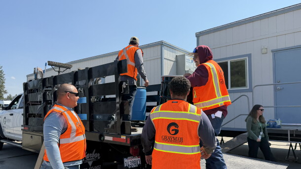 Hazmat crews from GrayMar from Mead, Wash., are cleaning up hazardous household materials after the Spokane Complex fires.