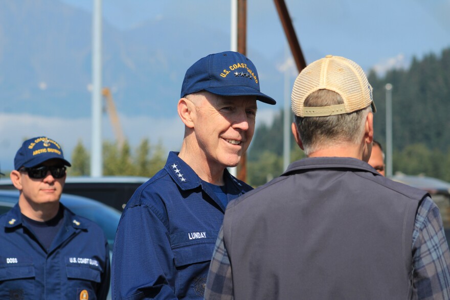 28th Commandant of the U.S. Coast Guard Admiral Kevin Lunday (center) speaks with U.S. Sen. Dan Sullivan in the JAG Alaska shipyard on Monday, Aug. 10, 2026 in Seward, Alaska.