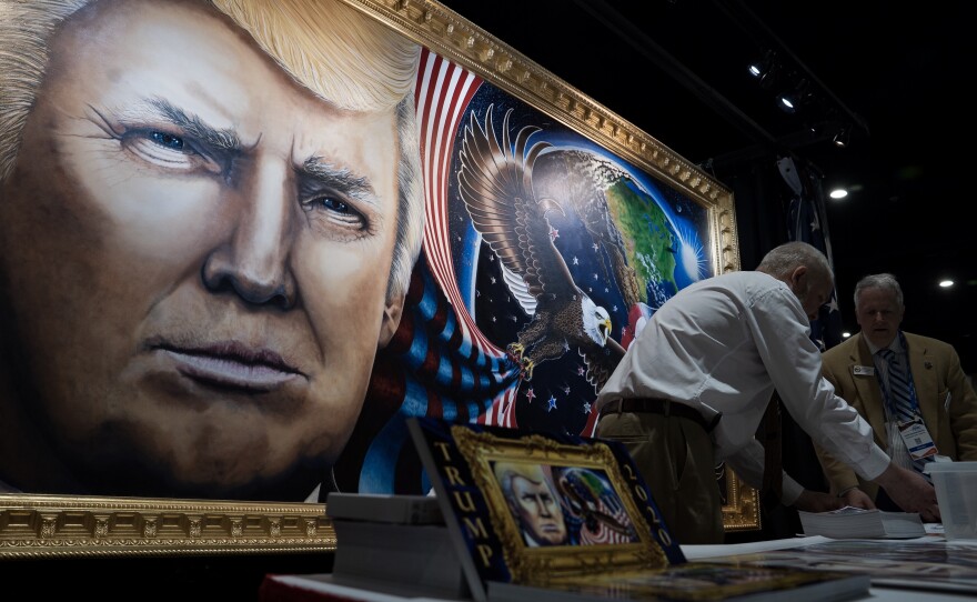 The 8-by-16-foot painting of President Trump by artist Julian Raven is on display at the Conservative Political Action Conference in National Harbor, Md.