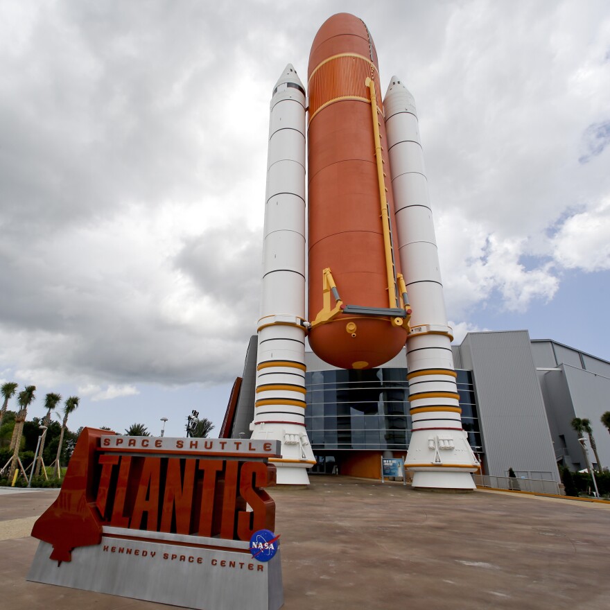 The entrance to the Atlantis exhibit features a replica fuel tank.