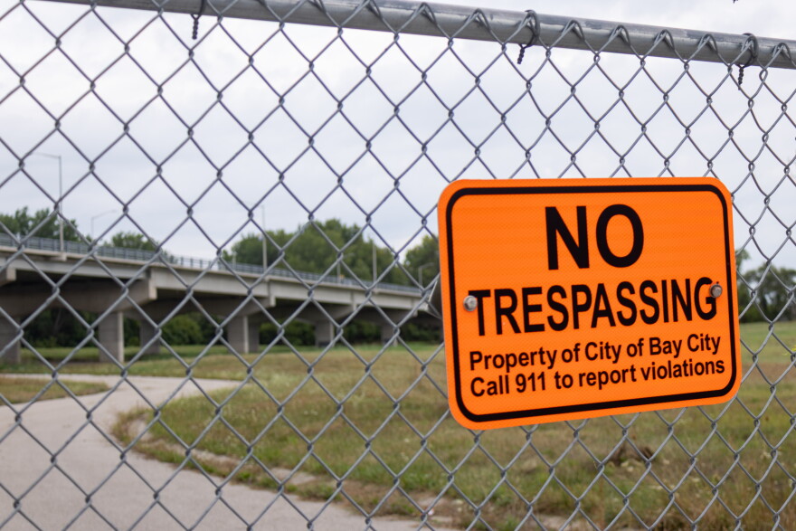 An area near Bay City's Liberty Bridge is contaminated with high levels of toxic metals. Officials are trying to rehome more than 10 people who were staying on the city proeprty.