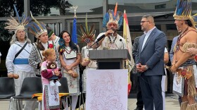Kasike Kalatauma accepts a copy of the resolution recognizing Connecticut's Taíno descendants from co-sponsors Reps. Geraldo Reyes and Christopher Rosario (right) on Oct. 15, 2025.