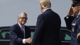DeWine greets President Trump at Wright-Patterson Air Force Base in Dayton in Aug. 2019.