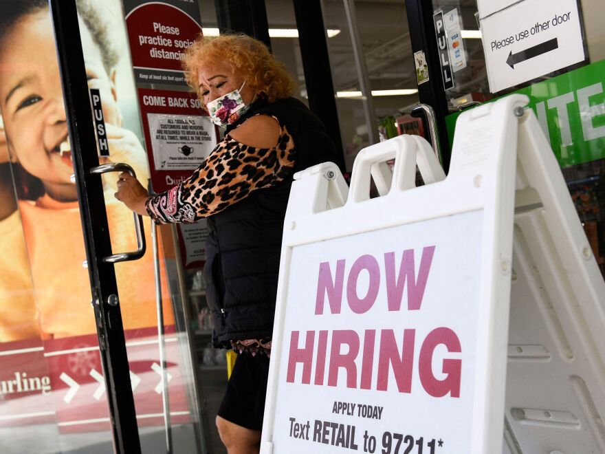 A 'now hiring' sign is displayed outside of a Burlington Coat Factory retail store in downtown Los Angeles on March 11.