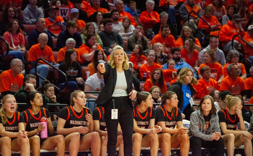 Girls high school basketball players inside an arena