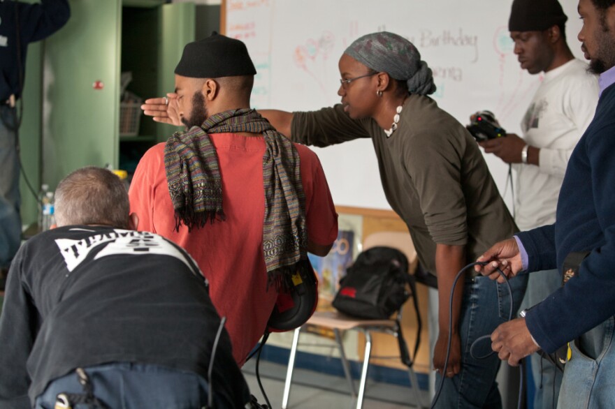 Rees (center) says the film is "semi-autobiographical." Having her parents see <em>Pariah</em> helped her talk openly with them about her own life.