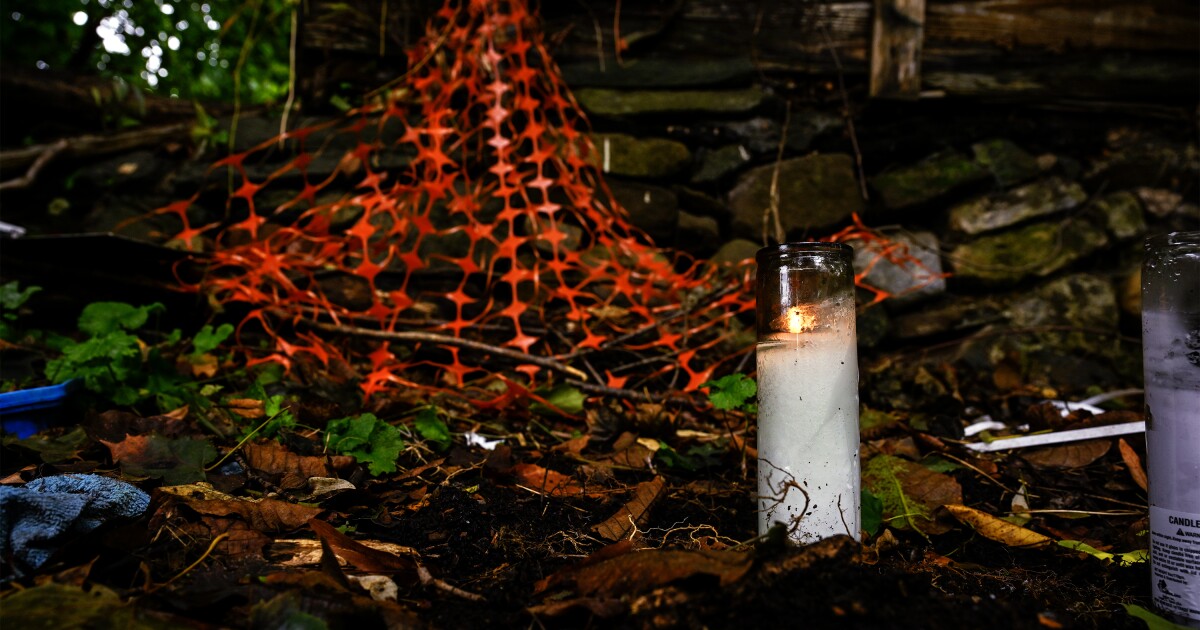 A candle burning in the backyard of the abandoned home where the remains of 12 year old Jacqueline “Mimi” Torres Garcia were found in New Britain, Connecticut on October 14th 2025.