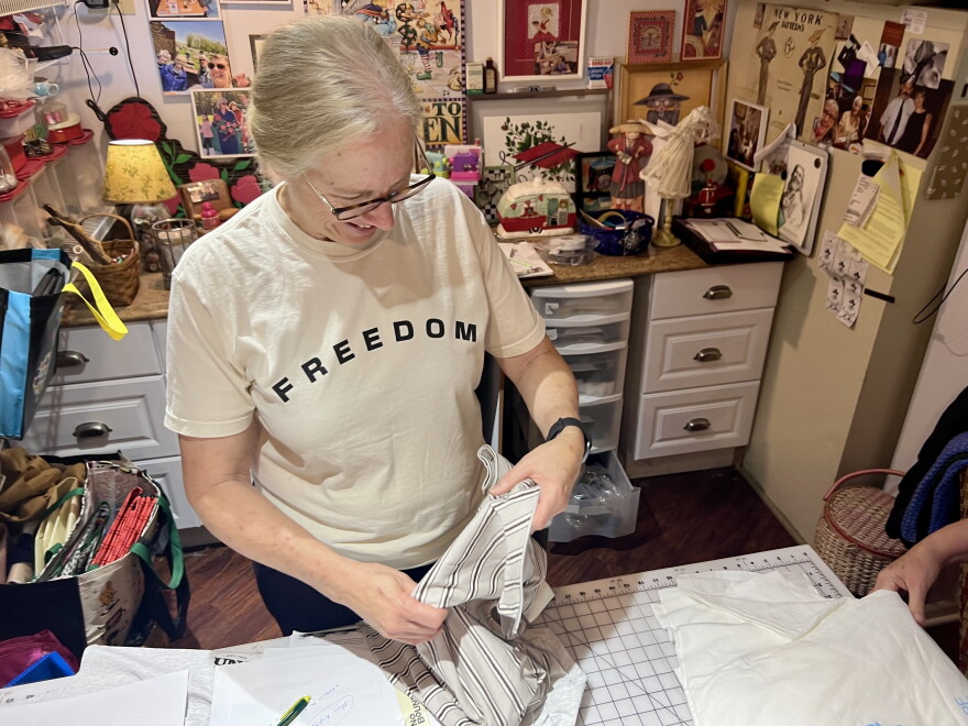 Marysville resident Patty Luther smiles as she presents her first zippered shirt designed for chemotherapy patients.