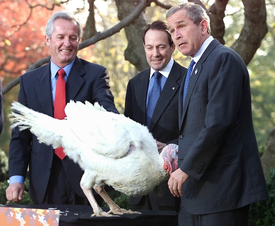 President George W. Bush meets Liberty, the turkey he pardoned that year in the Rose Garden. Liberty got a little too close for comfort.