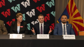 Elaine Groggett of Arizona Western College, Ryan Thornell, director of the Arizona Department of Corrections, Rehabilitation and Reentry, and Ruben Rosas-Parra, warden of the Arizona State Prison Complex-Yuma, pose for a photo during a news conference at Arizona Western College.