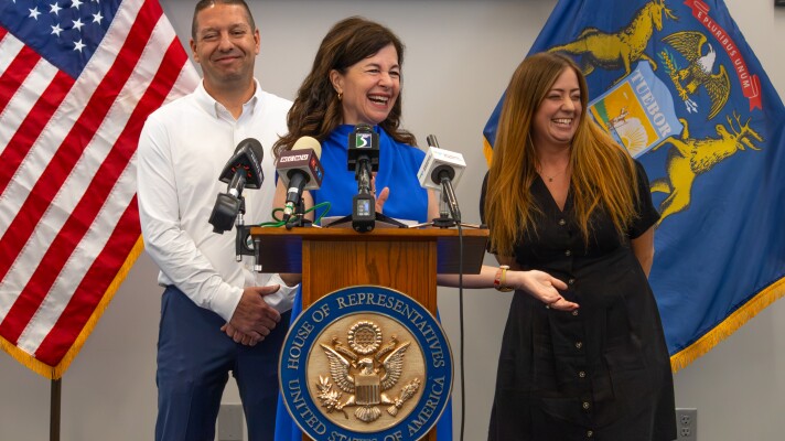 Kristen McDonald-Rivet (D-Bay Citys is joined by Chelsea Fitzgerald of Saginaw and Justin Pommerville with UA Local 85, as she holds a press conference for a recently introduced anti-corruption bill in Saginaw, Michigan, on Friday, July 10, 2026.