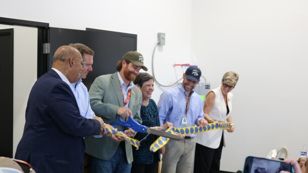 Governor Andy Beshear, second from left, Lexington-Fayette Urban County council member Hil Boone, Lexington Mayor Linda Gorton and others join other local and industry officials in a ribbon cutting ceremony for Holler Cannabis Company on August 21, 2026. Holler Cannabis Co. is a medical cannabis cultivator, licensed to grow medical cannabis for the burgeoning Kentucky industry.
