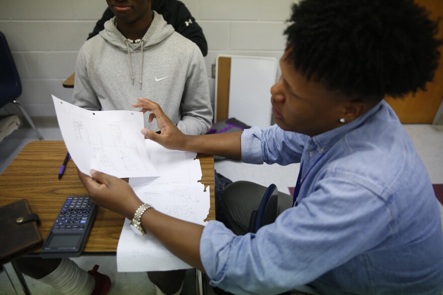 Johnson tutors students in math at Lafayette High School in Oxford.