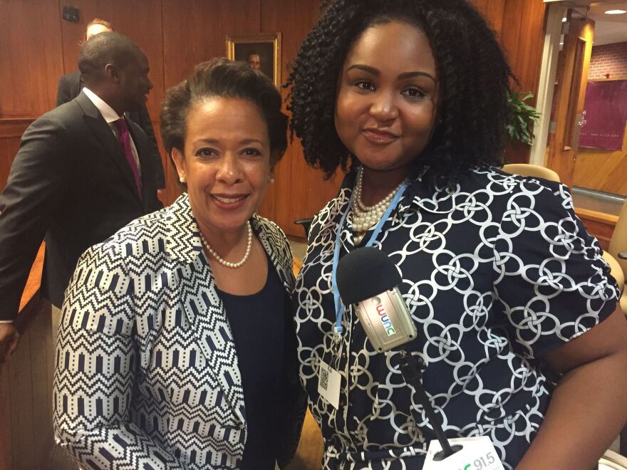 An image of a youth radio reporter and US Attorney General Loretta Lynch