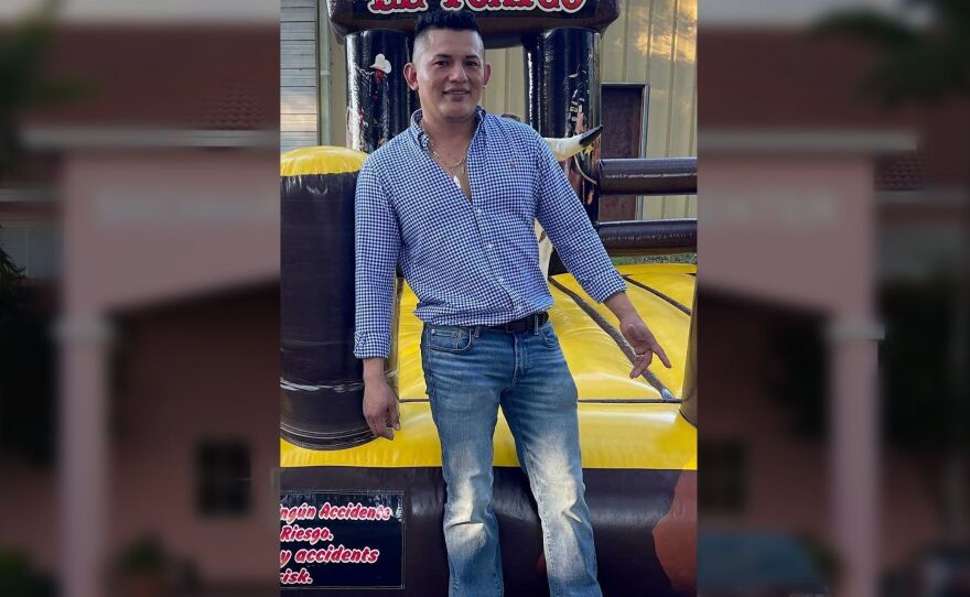 Freddy Tellez Lopez stands in the middle of this edited photo, with an immigrant detention facility in the background.