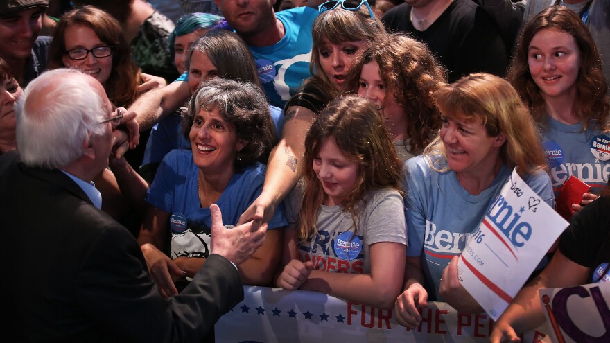 Bernie Sanders greets the audience at a fundraising event and rally.