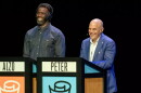 Two men named Peter and Alzo stand at podiums during a game show