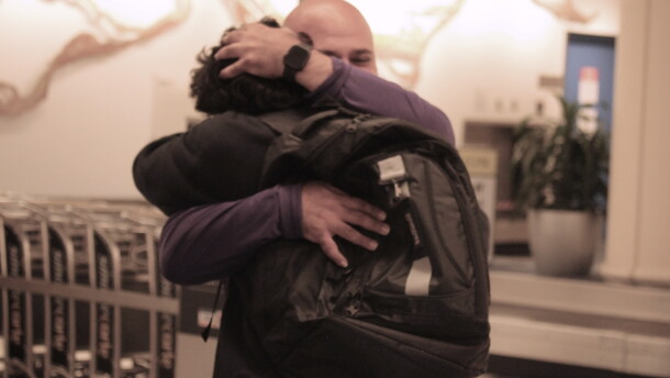 Sebastian Jimenez Peroza hugs his football coach, Ashour Peera, who advocated for his release from immigration detention facilities. (María Sofía Rodríguez/WUFT News)