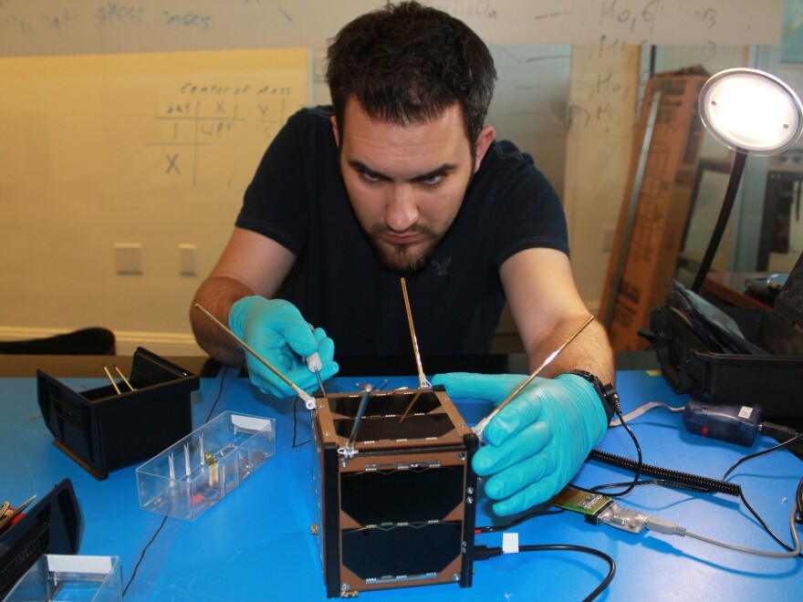 Marshall Culpepper works on satellite integration.