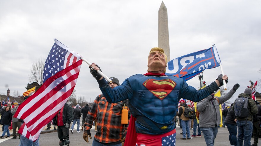 A Trump supporter dressed as the president in a Superman outfit attends the Jan. 6 rally against the election results before rioters stormed the U.S. Capitol.