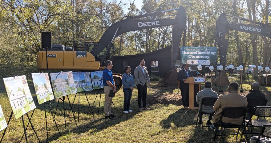 (Left-to-right) Tallahassee Housing Consortium's Greg Lane and Karen Miller, Leon County Commission Chair Christian Caban and (at rostrum) Tallahassee Mayor Pro-Tem Curtis Richardson.
