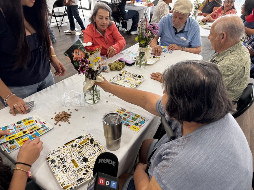 Seniors play loteria with youth from San Luis High School.