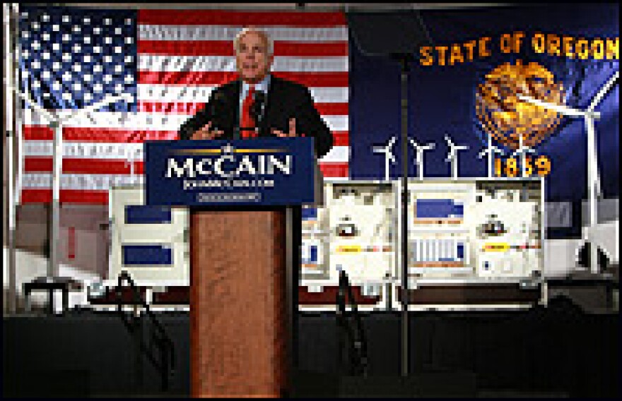 With miniature wind turbines behind him, Sen. John McCain (R-AZ) speaks about climate change on May 12, 2008, in Portland, Ore.