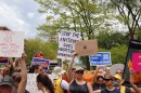 a group of people holding signs both for and against abortion rights in michigan stand on the quad at the University of Michigan in Ann Arbor in May 2022