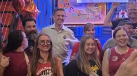 Adam Bojak (middle) celebrates with supporters at his primary night viewing party on Buffalo's West Side following his victory in the 149th Assembly District Democratic primary.