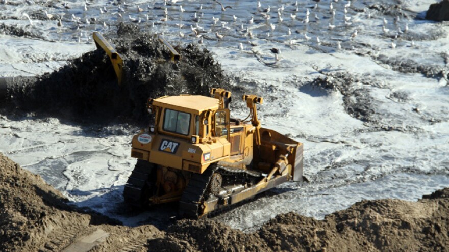 Ongoing beach nourishment, like this project in Viriginia Beach, has been the topic of debate. Some people say it's needed to protect beach communities; others decry the costs.