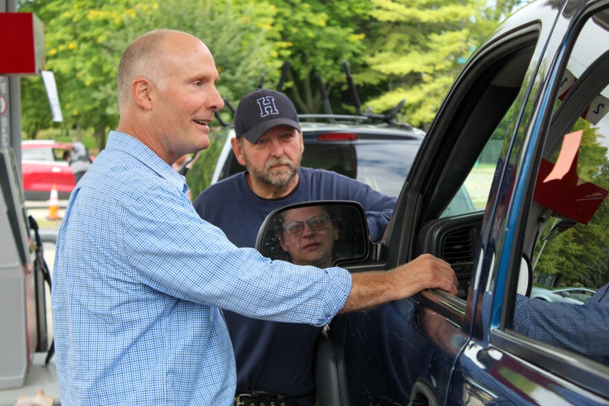 Michigan Congressman John Moolenaar, R-Midland, speaks with constituents at an Alma gas station on Sept. 12.