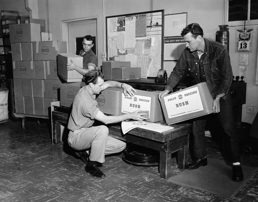 In the shipping room at Cutter Laboratories in Berkeley, Calif., workmen label packages of Salk polio vaccine.