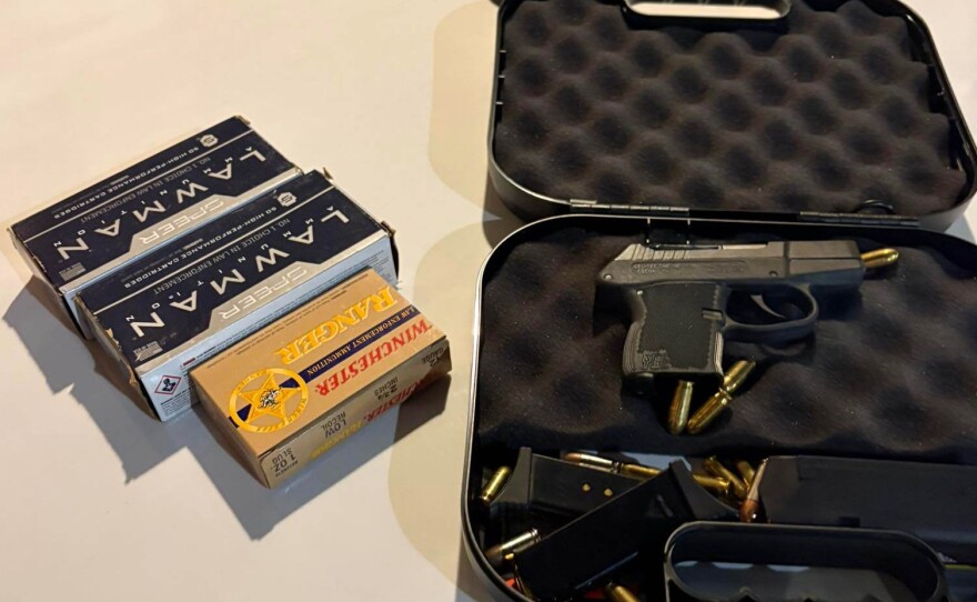 This photo provided by the Okaloosa County Sheriff's Office on Thursday, April 23, 2026, shows a handgun and ammunition recovered from Christopher Gillum's room after he was arrested at a hotel in Destin, Fla. (Okaloosa County Sheriff's Office via AP)