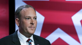 FILE - Suffolk County Congressman Lee Zeldin listens as he prepares to participate in New York's Republican gubernatorial debate at the studios of CBS2 TV, June 13, 2022, in New York. Zeldin, the Republican challenging New York Gov. Kathy Hochul in next month's election, has delivered his anti-crime message while speaking at buildings and bodegas in diverse New York City neighborhoods. (AP Photo/Bebeto Matthews, File)