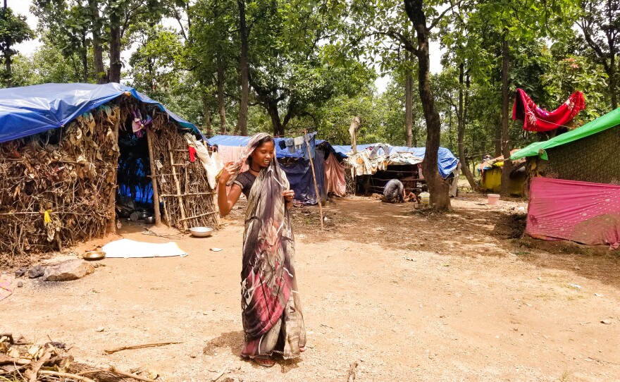 Nisha Devi lives in a rudimentary hut covered with a tarp near Ramgarh, in India's Jharkhand state. She believes hunger led to her uncle's recent death before he could get an Aadhaar card. The rest of the family has scrambled to enroll since his death, but Devi has been unable to draw welfare benefits so far.