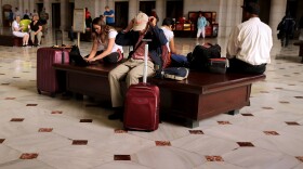 Do you have some free time this Labor Day weekend? Spend it reading about a fascinating frame-up — or pondering the long hours we work. Here, travelers wait for trains at Union Station in Washington, D.C., on Friday, the start of the holiday weekend.