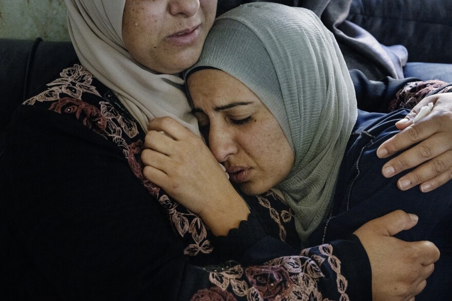 Sisters, wives, mothers, cousins of the community gather and mourn at the Qusra wake for for four of the six men killed in Qusra, Palestine.