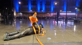 Protesters in Raleigh pulled down statues from a Confederate monument Friday night after marching in celebration of Juneteenth. The monument was dedicated in 1895.