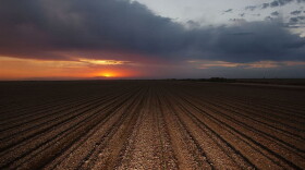 The sun sets on a plowed field that will need Colorado River water to yield a crop October 17, 2002 near El Centro, California. (David McNew/Getty Images)