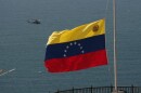 A helicopter takes off from a U.S. Navy ship docked at the seaport to support earthquake relief efforts in La Guaira, Venezuela, Monday, June 29, 2026.