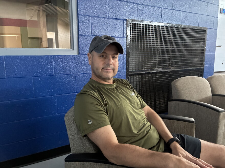 Youssef Bouzidi sits courtside at the pickleball courts at Carilion Wellness.