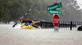 men on kayaks