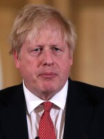 British Prime Minister Boris Johnson, seen on March 22, tested positive for the coronavirus 10 days ago. He's been admitted to a hospital for testing.
