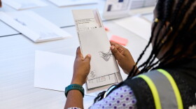 Wake County Board of Elections employees prepare absentee ballots to be mailed on Thursday, Sept. 3, 2026, in Raleigh, N.C.