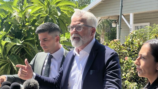 Attorney Jason Sanchez, center, joined by his colleagues Robbie Muñoz and Cynthia Santiago at a press conference held outside of Francisco Longoria's home. Longoria says his truck was shot at by federal immigration agents last week and wants answers. Sanchez, Muñoz and Santiago want city and county officials to investigate the shooting.